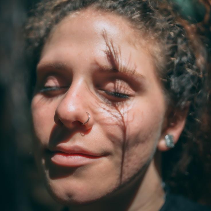 Alex Rivera, Chief Design Curator at Harbor Frame Corner, reviewing corporate floral arrangements